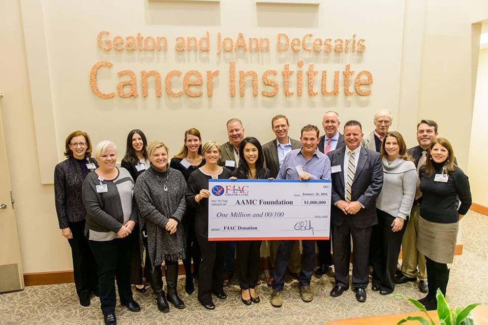 Fish for a Cure Presents Check to AAMC