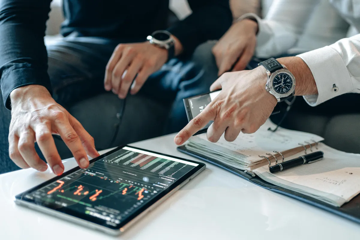 Q2 2026 quarterly perspective - investors pointing the screen of the tablet with crypto graph