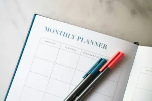 When life gets hard, preparation makes the difference blog header - a planner with two pens